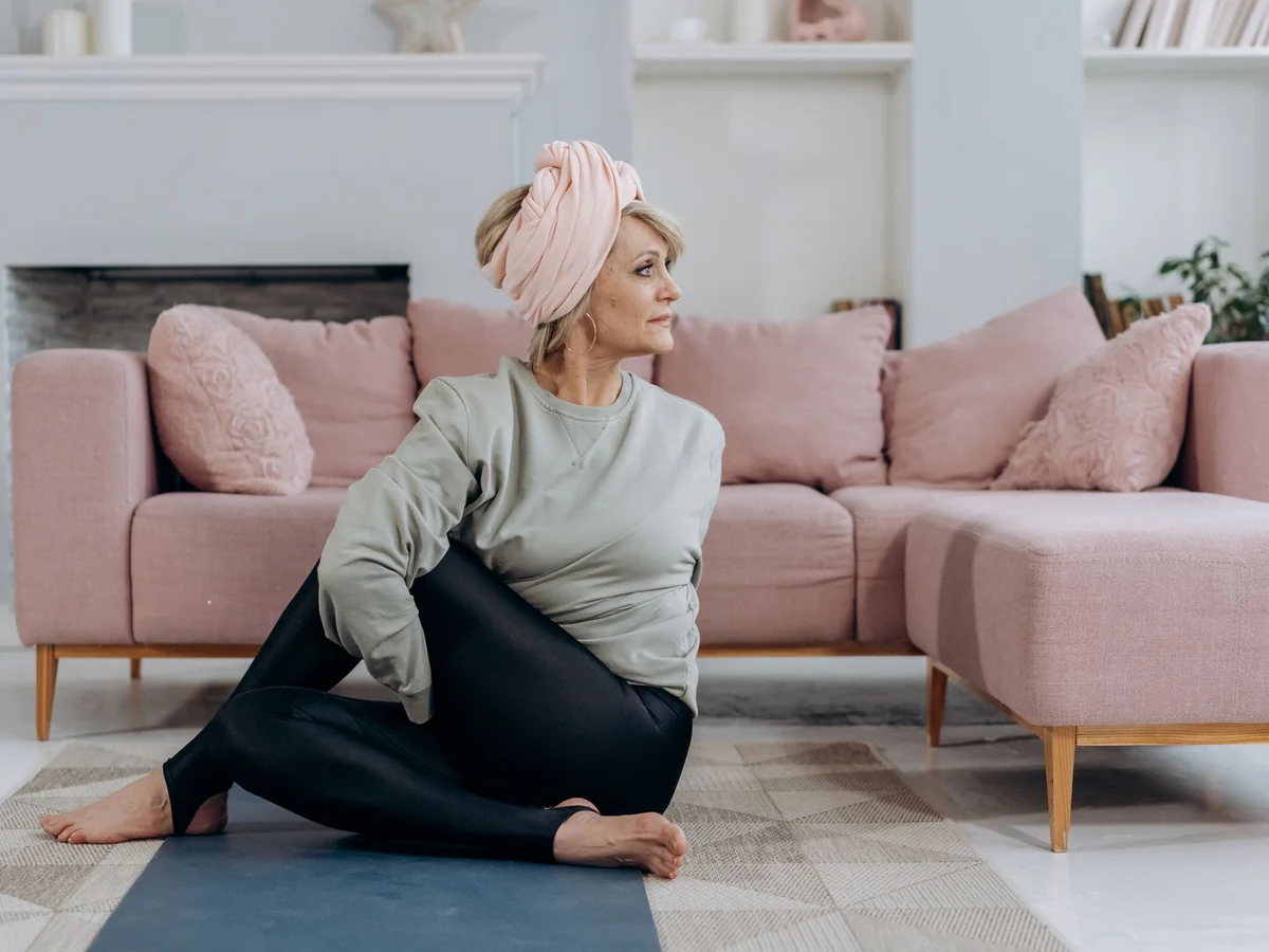 Woman arranging a calm and functional home wellness space